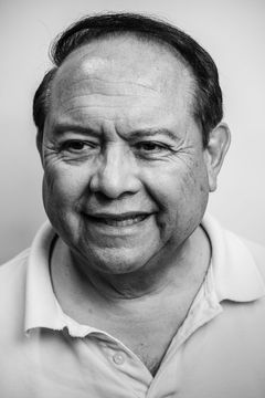 A duotoned black-and-white portrait of Tim Miguel.