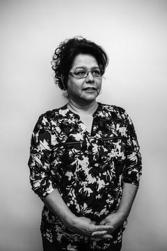 A duotoned black-and-white portrait of Lucy Pedregon.
