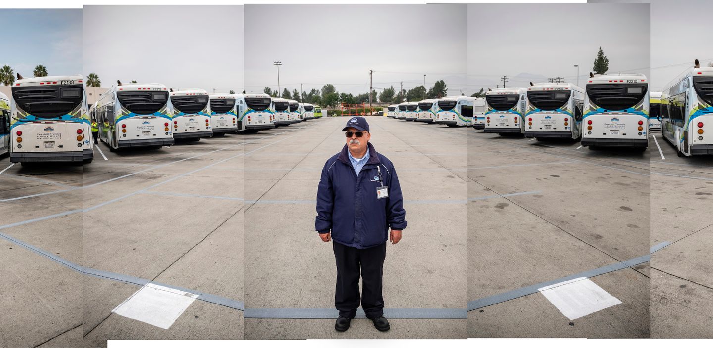 Foothill Transit bus driver, Arturo Ramirez, stands for a portrait at the bus yard in Pomona, CA after his shift.