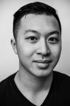 A duotoned black-and-white portrait of Nicholas Nguyen.