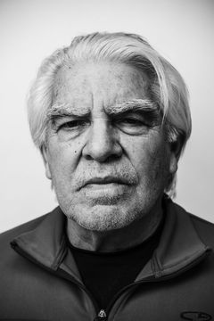 A duotoned black-and-white portrait of Jim Sanbrano.