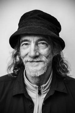 A duotoned black-and-white portrait of Michael Keenan.
