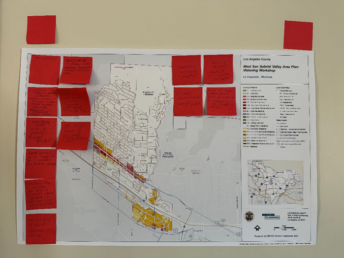 Picture of a map with red post-it notes.